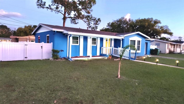 ranch-style house with a lawn