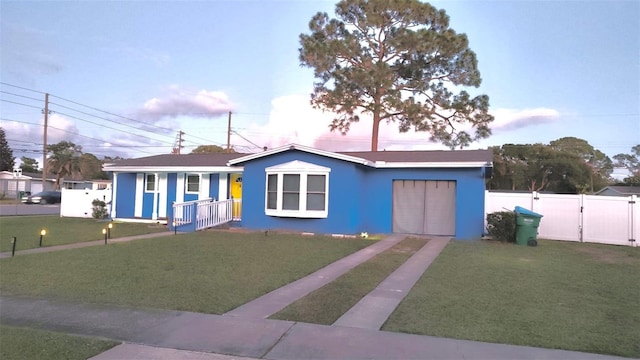 view of front of property with a yard