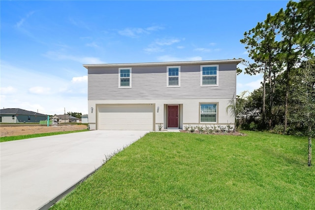 view of front of property with a front lawn and a garage