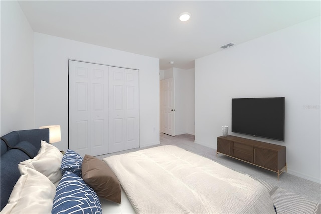 carpeted bedroom featuring a closet