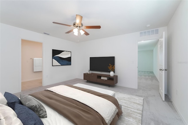 carpeted bedroom featuring ceiling fan and connected bathroom