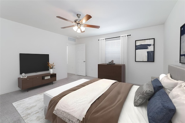 bedroom featuring light colored carpet and ceiling fan