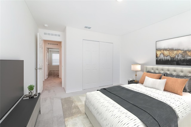 carpeted bedroom featuring a closet