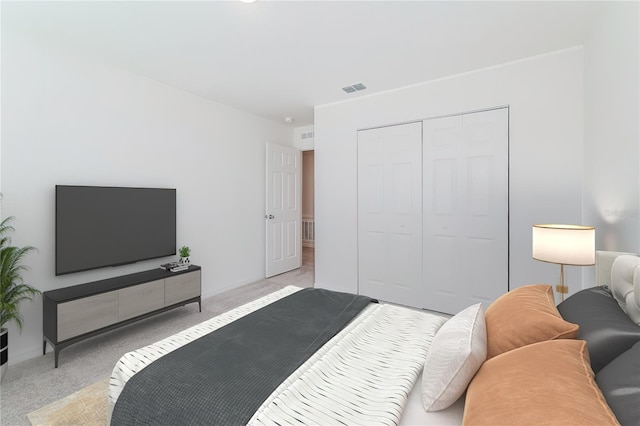 bedroom featuring light carpet and a closet