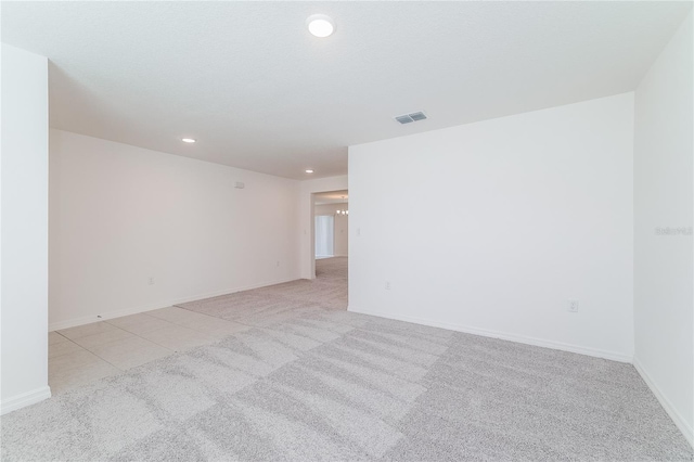 empty room featuring light carpet