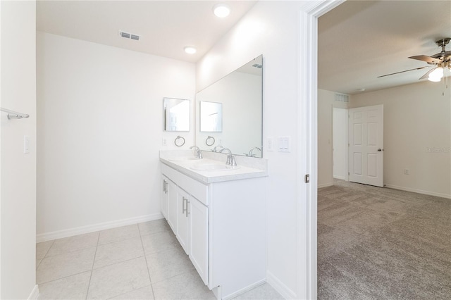 bathroom with ceiling fan, tile patterned flooring, and vanity