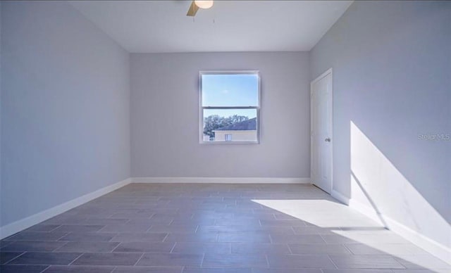 unfurnished room with ceiling fan