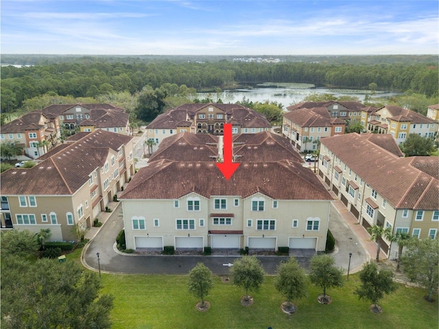 birds eye view of property with a water view