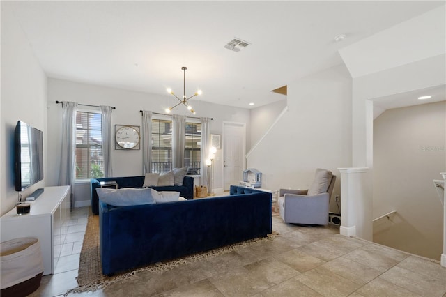 living room featuring a notable chandelier