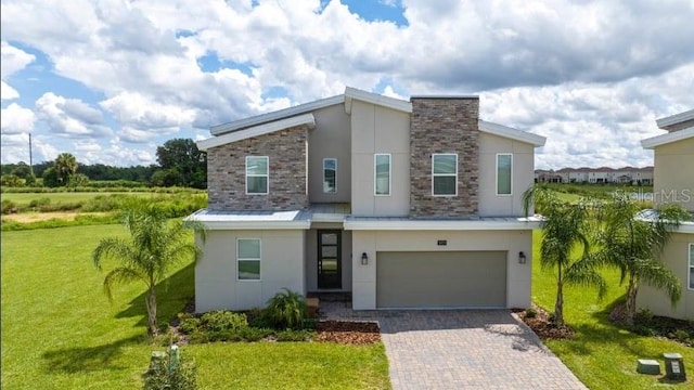 view of front facade with a front lawn and a garage