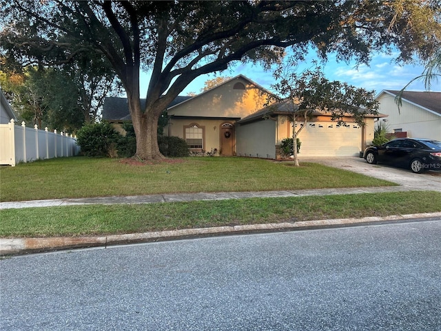 view of front facade with a front lawn and a garage