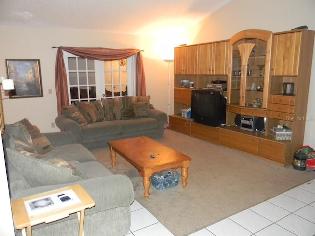 living room with light tile patterned flooring and french doors