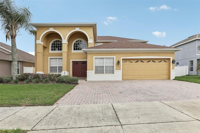 view of front of house featuring a garage and a front yard