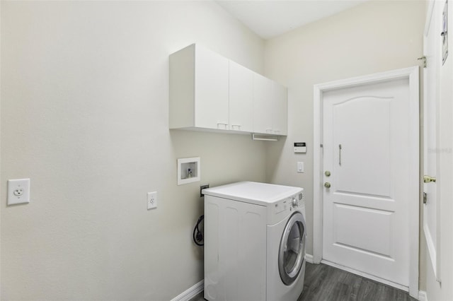 laundry room featuring cabinets, washer / dryer, and dark hardwood / wood-style floors