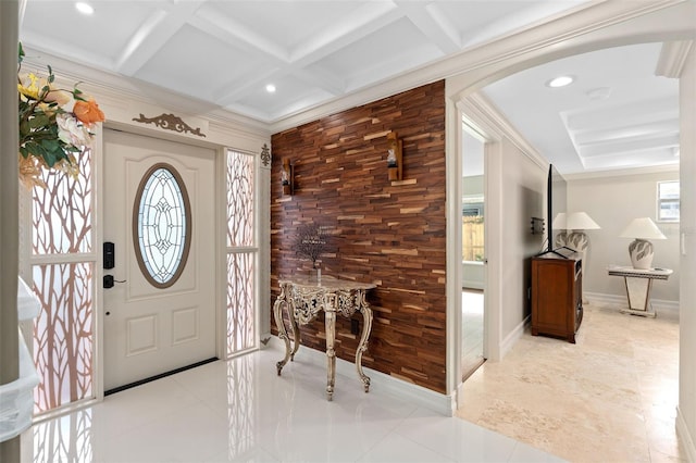 entrance foyer with beam ceiling, ornamental molding, and coffered ceiling