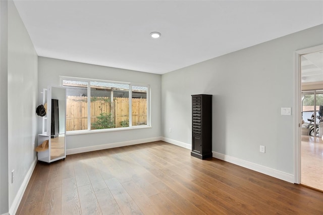 interior space featuring wood finished floors and baseboards