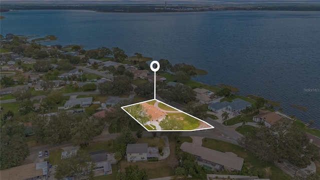 bird's eye view featuring a water view and a residential view