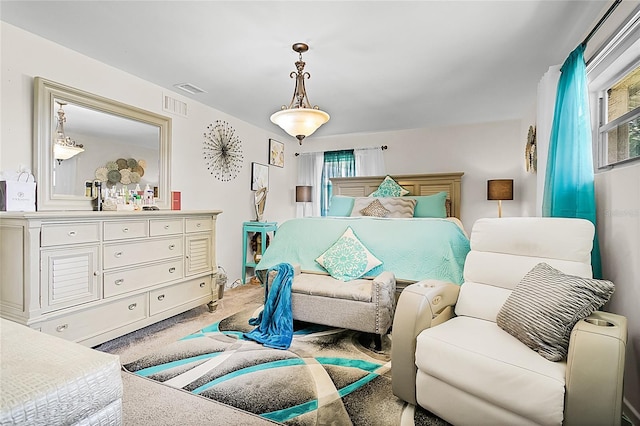 bedroom with carpet floors and visible vents