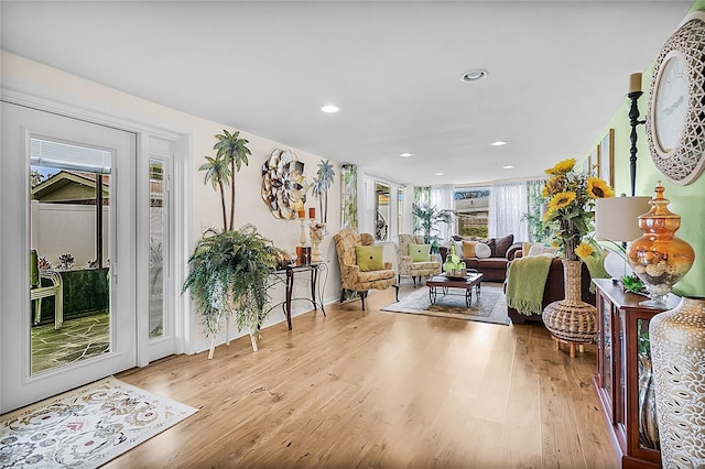 sitting room featuring light wood-type flooring and recessed lighting