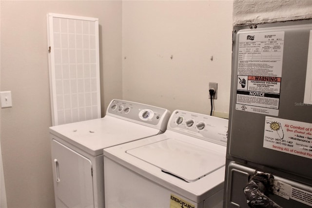 clothes washing area featuring washer and clothes dryer