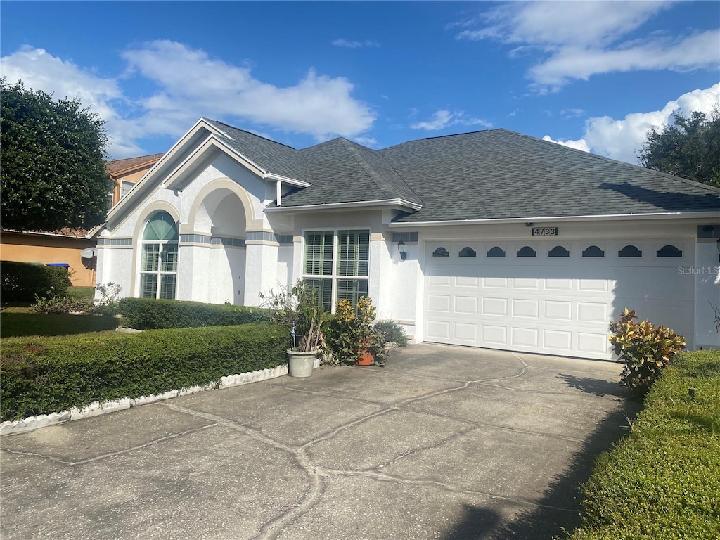 single story home featuring a garage