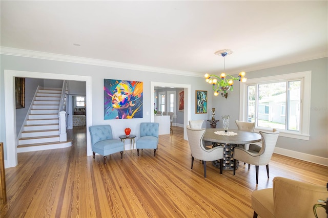 dining space featuring wood-type flooring and crown molding