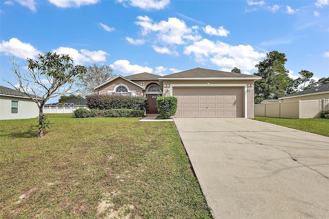 view of front of property featuring a garage and a front yard