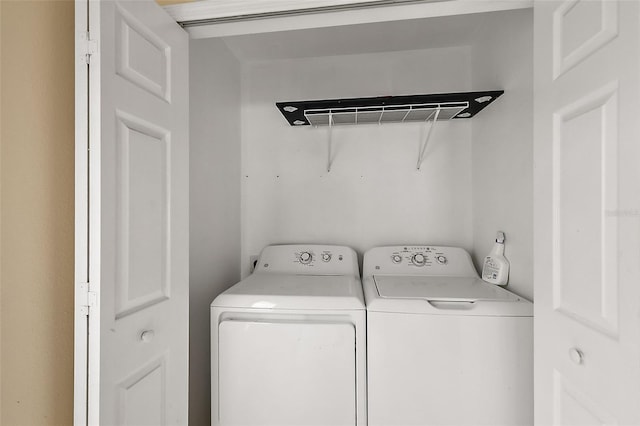 washroom with separate washer and dryer