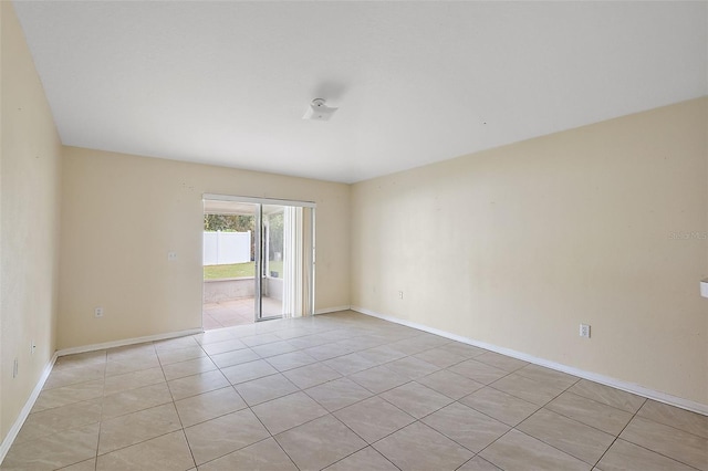 empty room with light tile patterned flooring