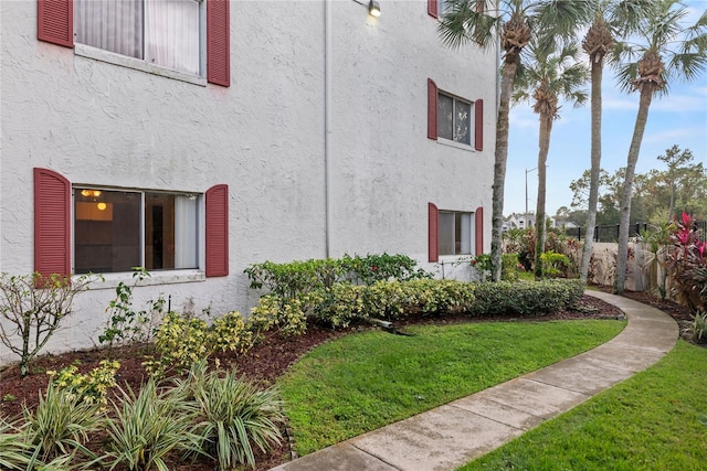 view of home's exterior featuring a lawn