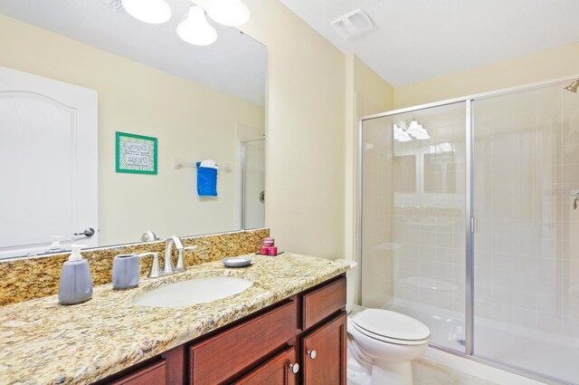 1423 Thunderbird Rd, Davenport, FL 33896 - bathroom featuring a stall shower, vanity, and toilet