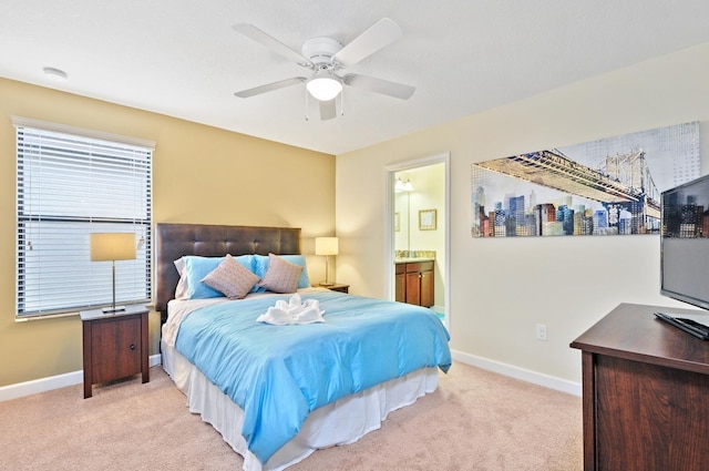 1423 Thunderbird Rd, Davenport, FL 33896 - bedroom with carpet floors, baseboards, ensuite bathroom, and a ceiling fan