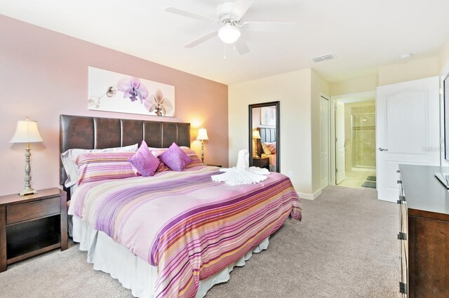1423 Thunderbird Rd, Davenport, FL 33896 - bedroom featuring light colored carpet, baseboards, connected bathroom, and ceiling fan