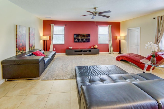 living room with ceiling fan and light tile patterned floors