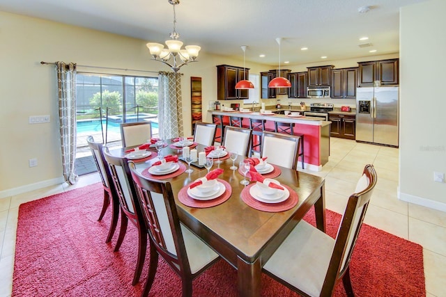 1423 Thunderbird Rd, Davenport, FL 33896 - dining space with light tile patterned floors, a chandelier, recessed lighting, and baseboards