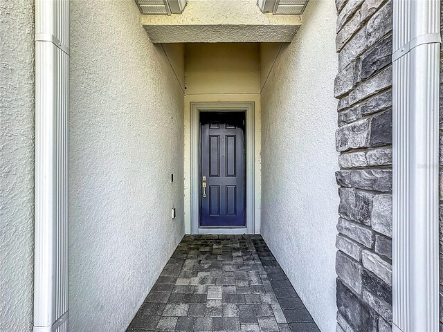 1490 Olympic Club Blvd, Champions Gate, FL 33896 - view of exterior entry featuring stucco siding