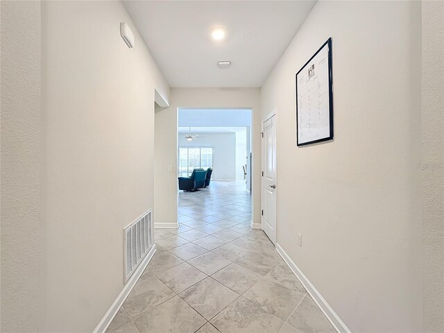 1490 Olympic Club Blvd, Champions Gate, FL 33896 - hall with light tile patterned floors and baseboards