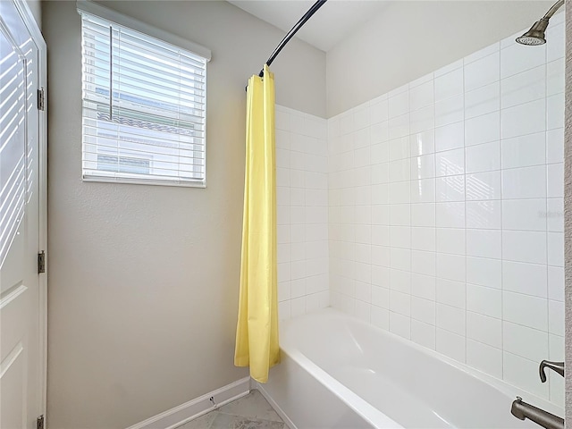 bathroom featuring shower / bath combo with shower curtain