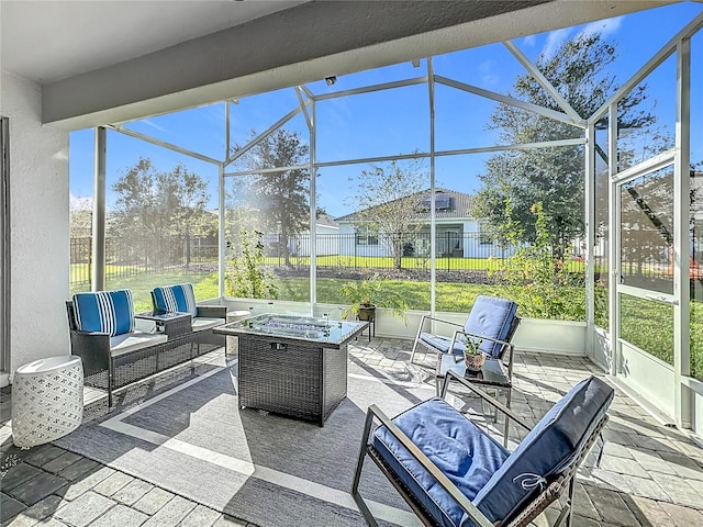 view of patio / terrace featuring glass enclosure