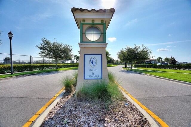 1490 Olympic Club Blvd, Champions Gate, FL 33896 - view of asphalt road with street lights, curbs, and sidewalks