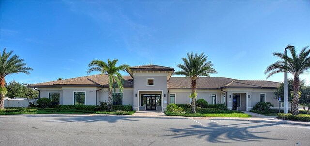 1490 Olympic Club Blvd, Champions Gate, FL 33896 - view of front facade featuring french doors and stucco siding