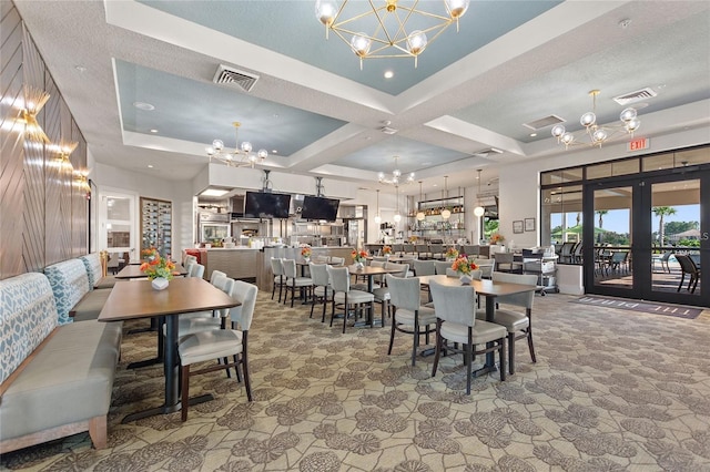 dining area with beam ceiling, a textured ceiling, french doors, and coffered ceiling