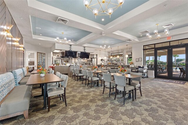 1490 Olympic Club Blvd, Champions Gate, FL 33896 - dining space featuring a chandelier, carpet floors, coffered ceiling, a raised ceiling, and french doors