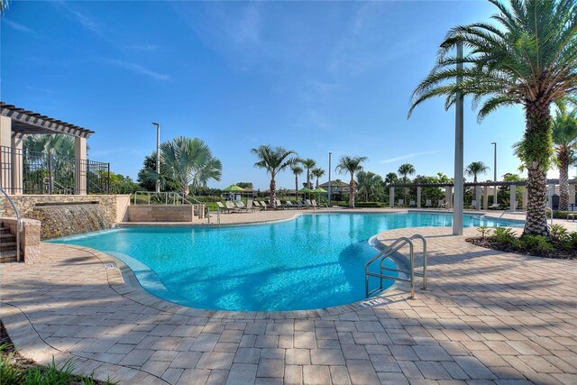 1490 Olympic Club Blvd, Champions Gate, FL 33896 - community pool featuring a patio area