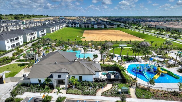 1490 Olympic Club Blvd, Champions Gate, FL 33896 - aerial perspective of suburban area featuring a pool area