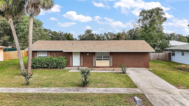 single story home featuring a front yard