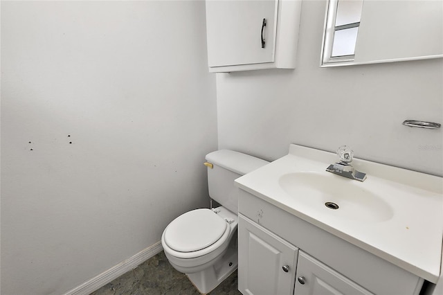 bathroom featuring toilet and vanity