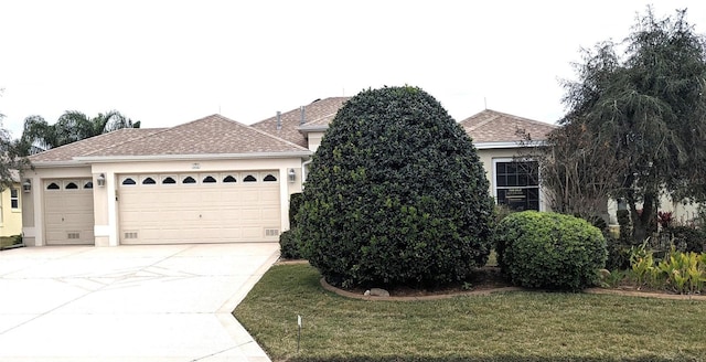 view of home's exterior featuring a garage and a lawn