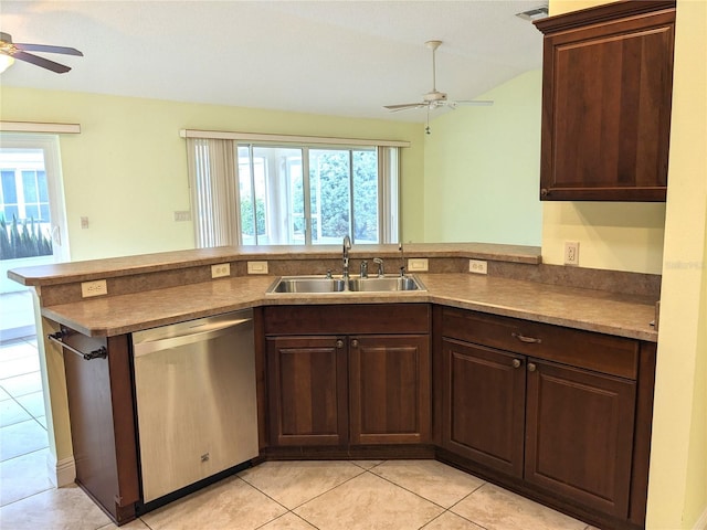 kitchen with dishwasher, sink, kitchen peninsula, light tile patterned floors, and dark brown cabinets