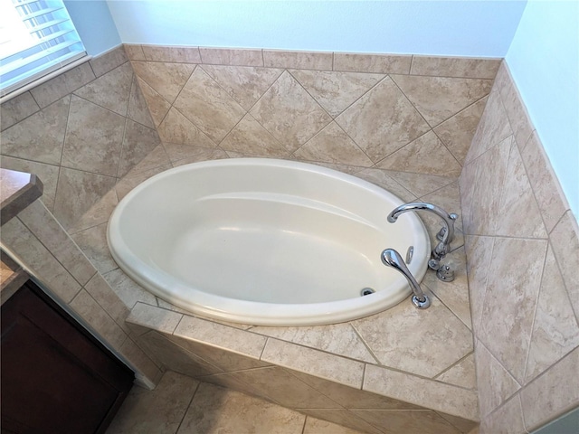 bathroom with tiled tub